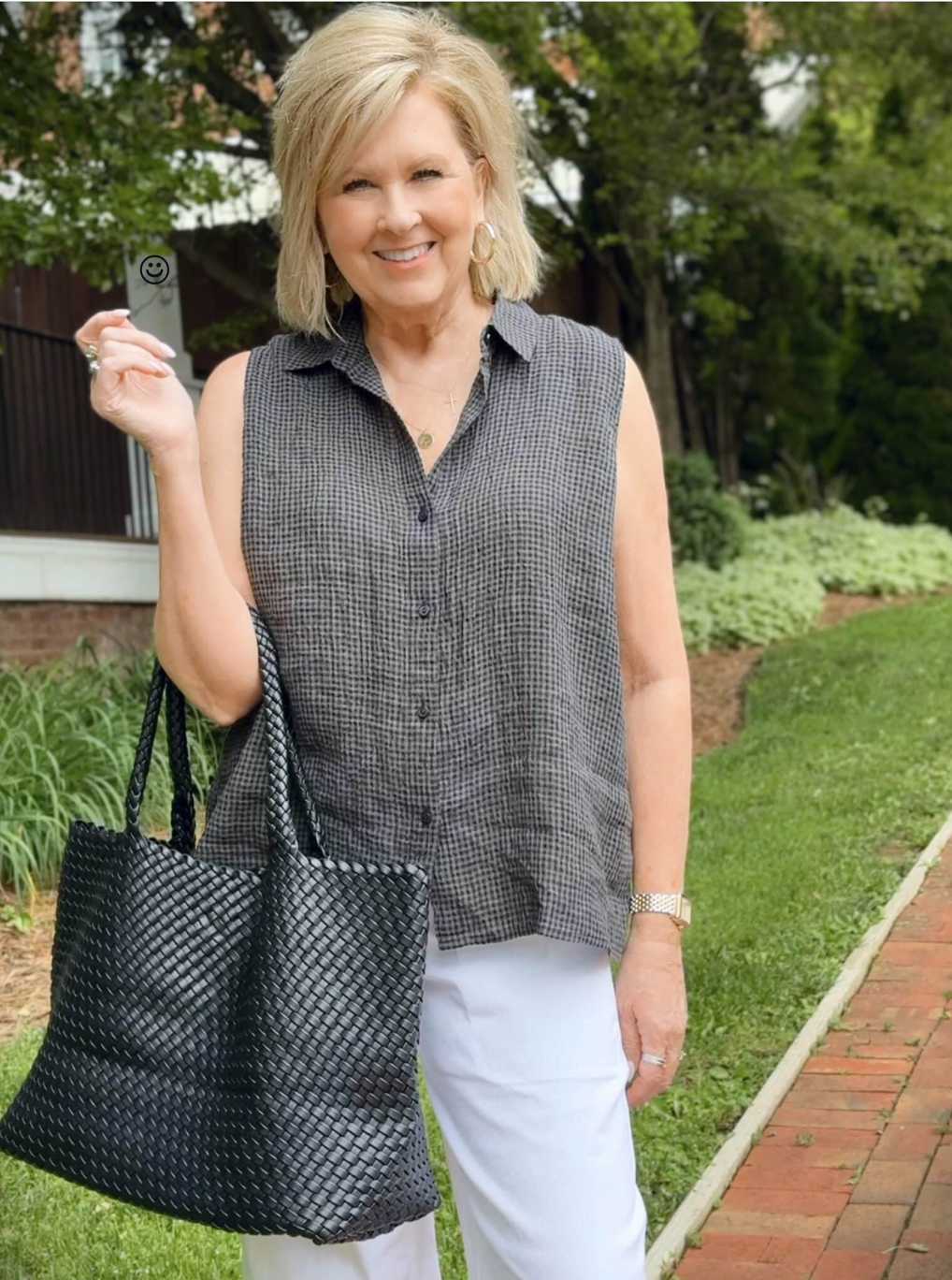 woman wearing a checked sleeveless top 